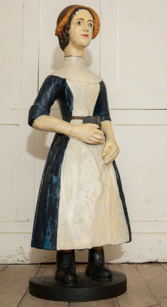 wooden statue of a girl - after conservation treatment